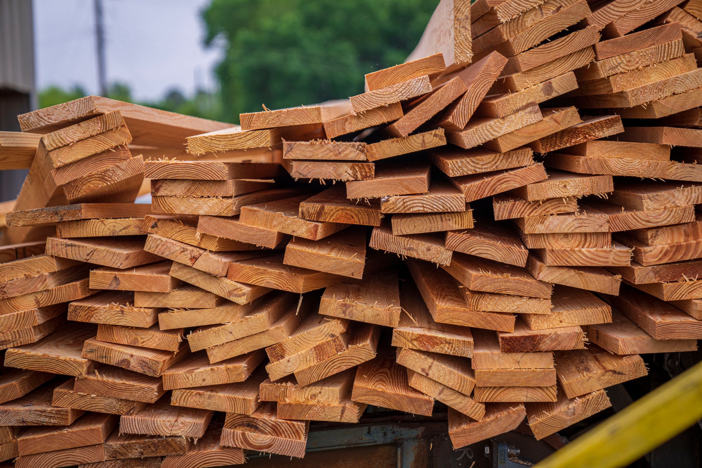 Stacks of rough sawn lumber showing natural wood grain